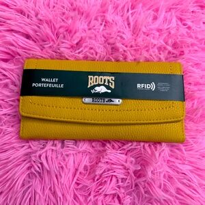 Roots Trifold Wallet. Brand new